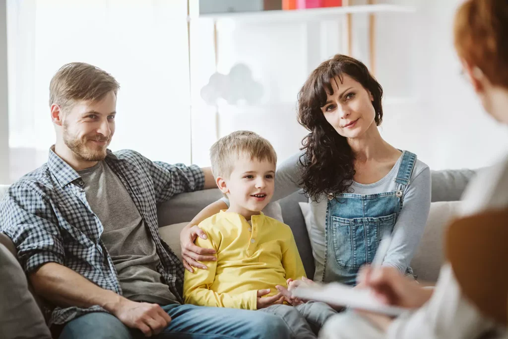 A young family of three is having a meeting with their therapist